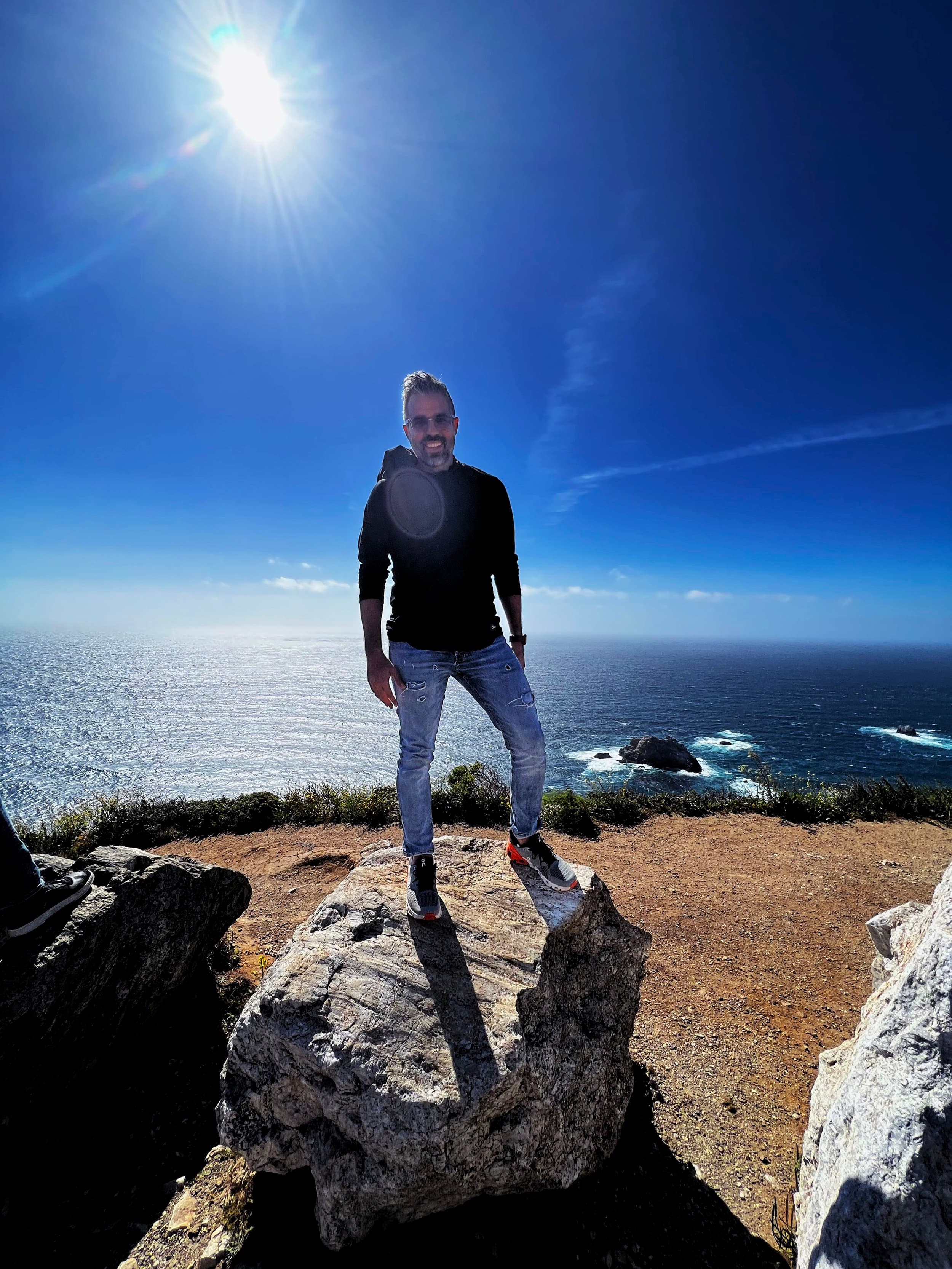 Standing on a rock overlooking the ocean